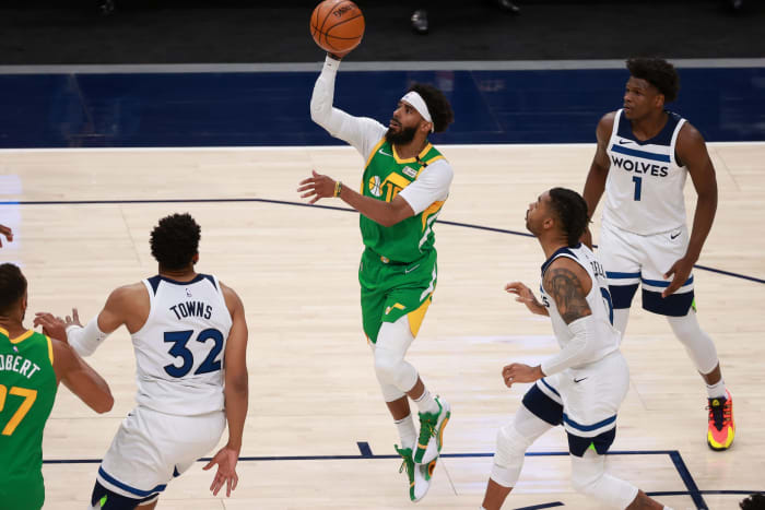 Mike Conley scores over the Minnesota Timberwolves